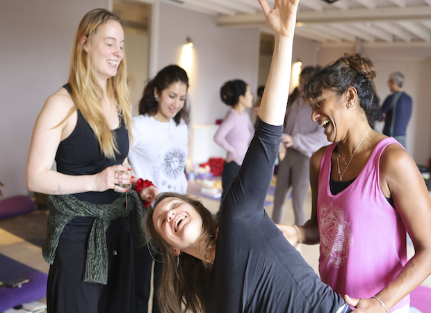 200 hour teacher training students learning to Assist each other during the course