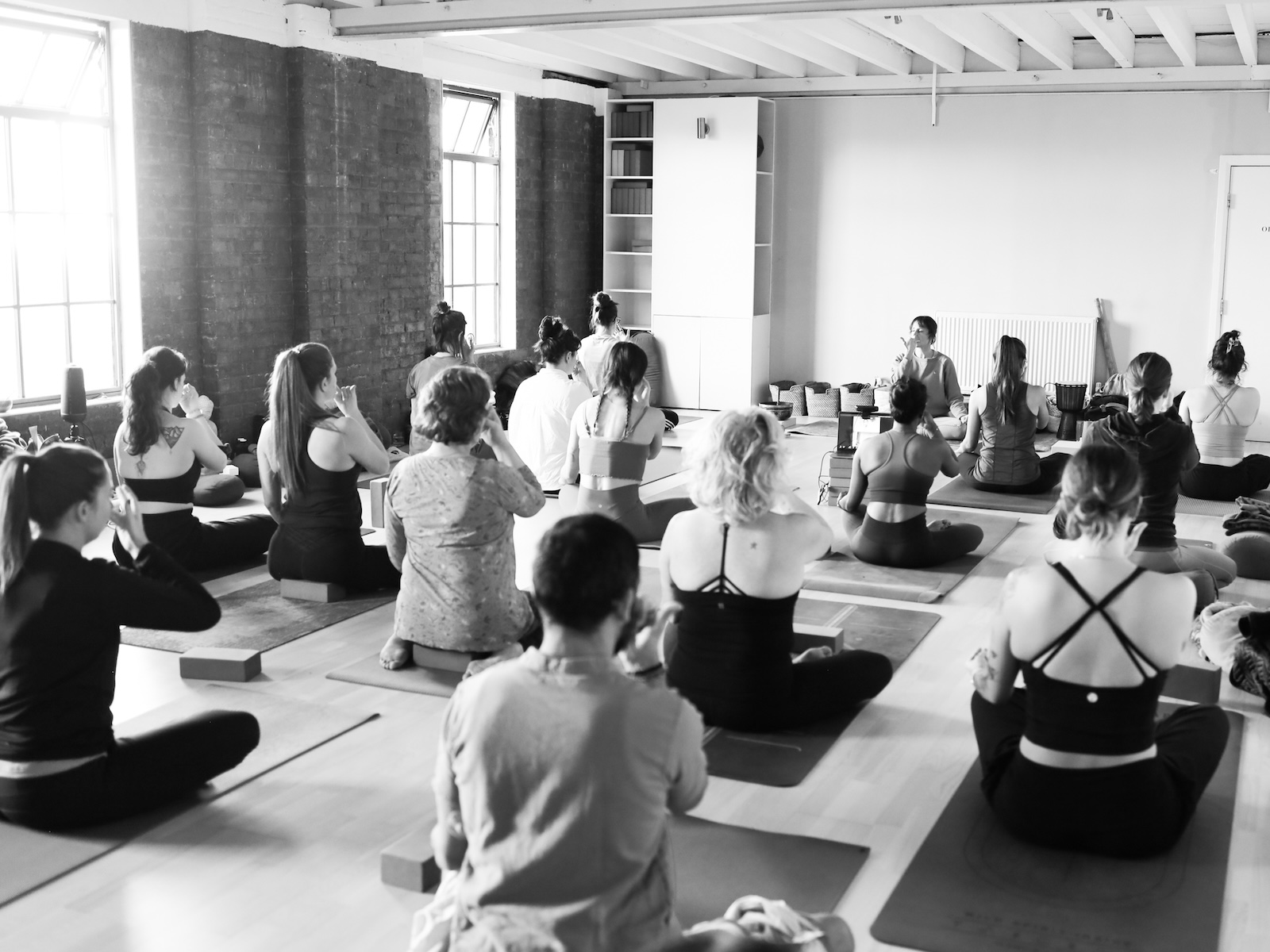 A teacher demostrating a pose for the 300 hour teacher course Embodied Asana