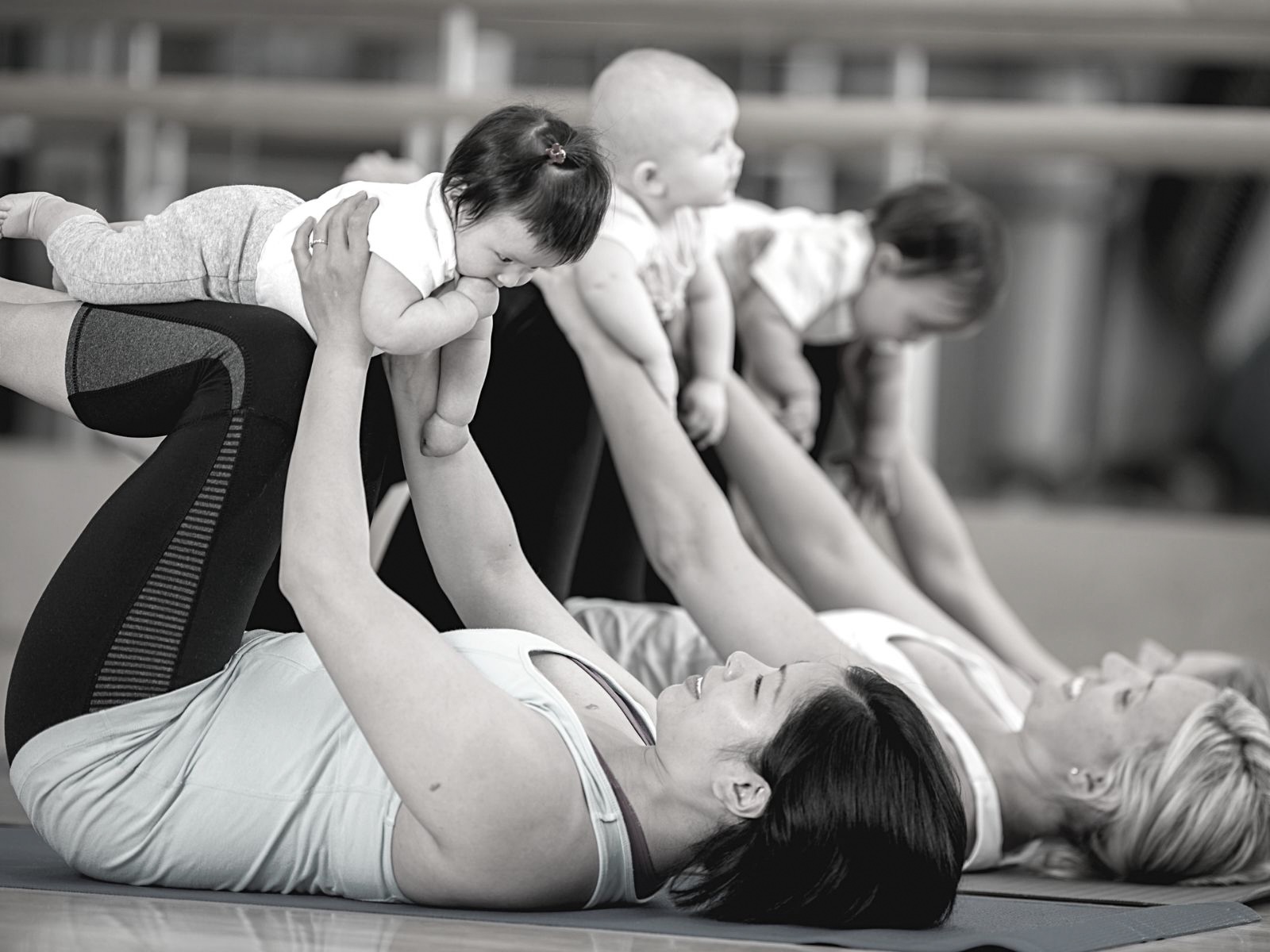 Mothers and babies in a post-natal Baby yoga teacher training