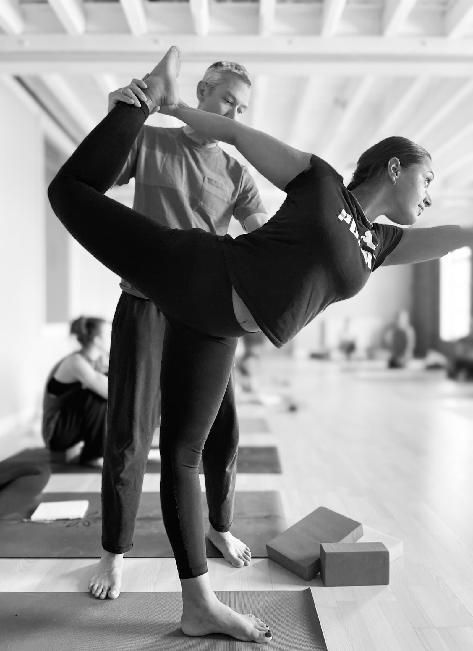 Gingi working with a student in Dancer's Posture on 300-hour Embodied Asana training