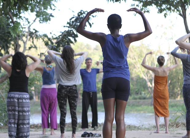 Gingi Lee teaching yoga by the lake at Ulpotha Retreat in Sri Lanka