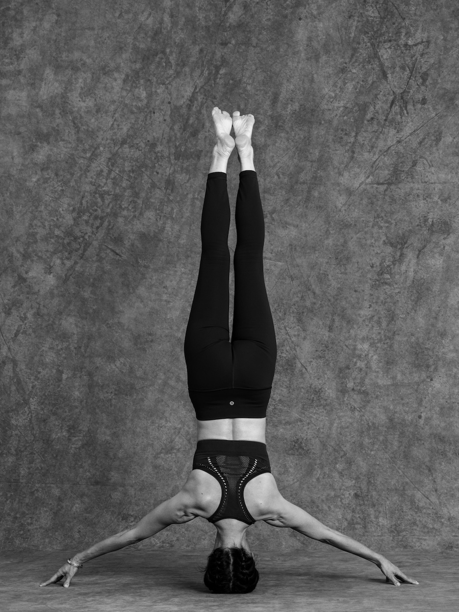 Image of someone doing headstand representing the Inversions, Arm Balances & Headstand Teacher Training Course