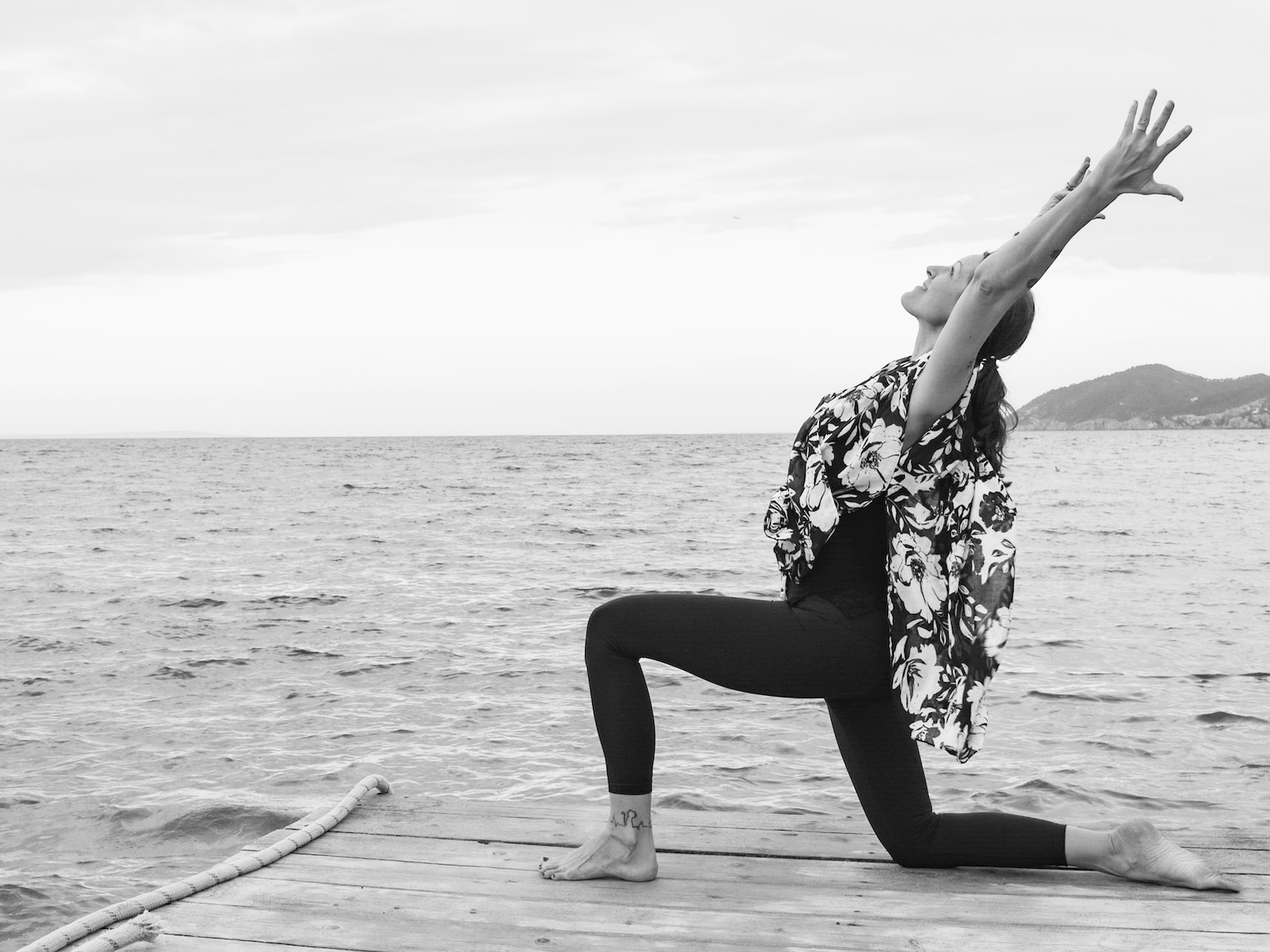 Jennie Wadsten Sharma practising yoga by the sea