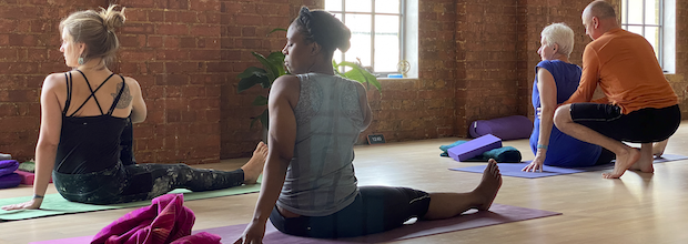 Learning how to adjust others on yoga teacher training course