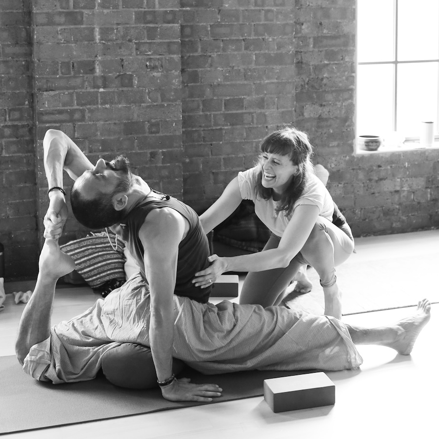 One Legged King Pigeon Pose with Deepak and Charli Van Ness on 200 hour teacher training