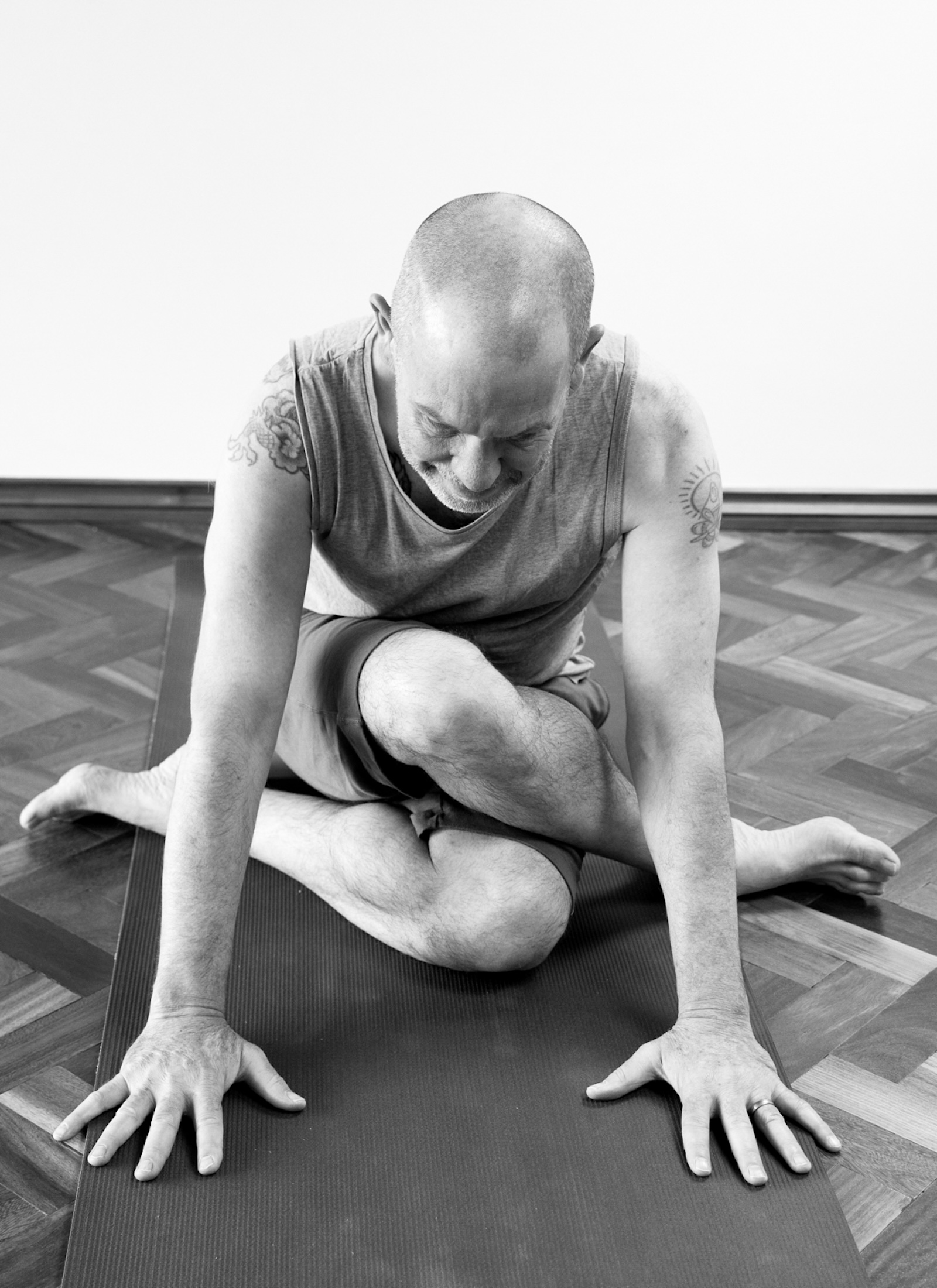 Yin yoga teacher Norman Blair in Shoe lace pose