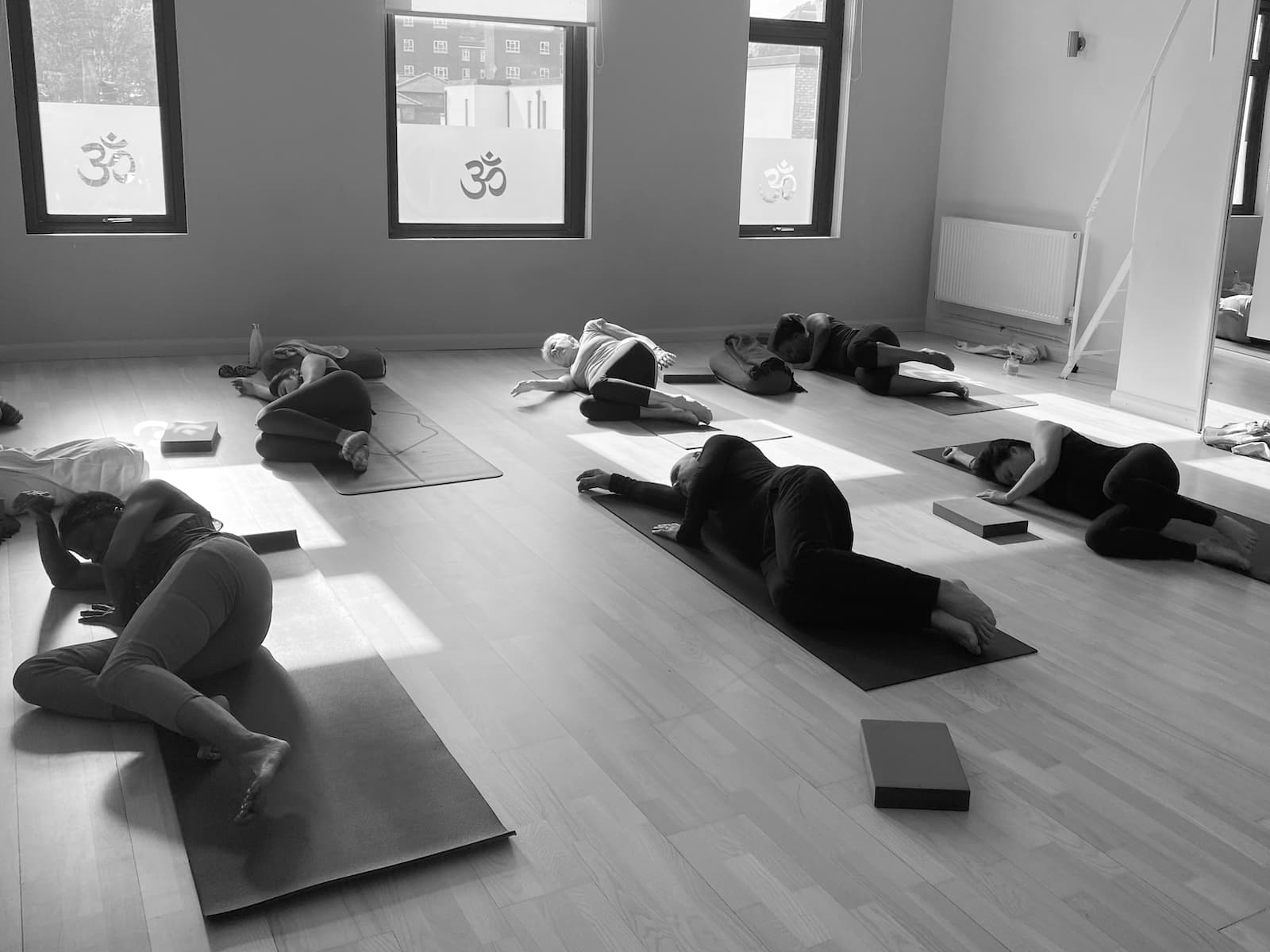Students practicing on trauma informed yoga teacher training weekend at the Shala
