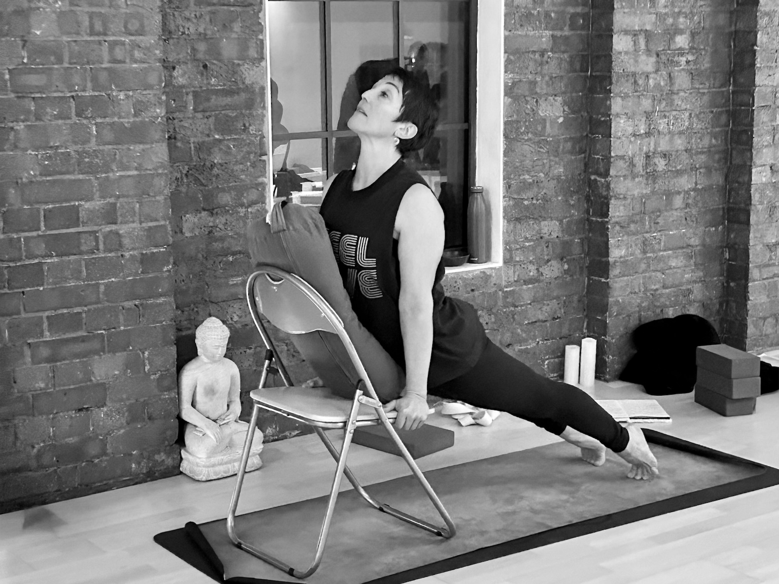 Trainee doing upward dog on a chair, Chair Yoga Teacher Training London