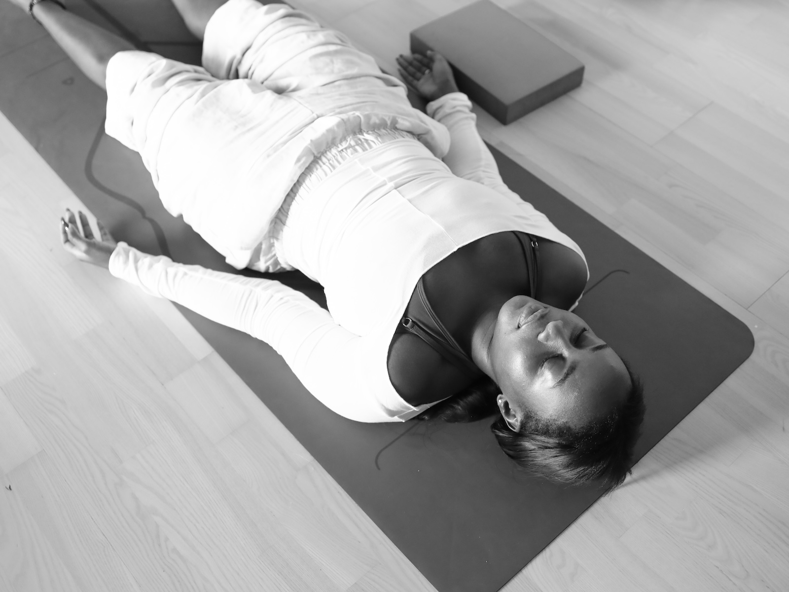 Student in deep relaxation at yoga nidra teacher training with Melanie Cooper and Jennie Wadsten Sharma, London UK