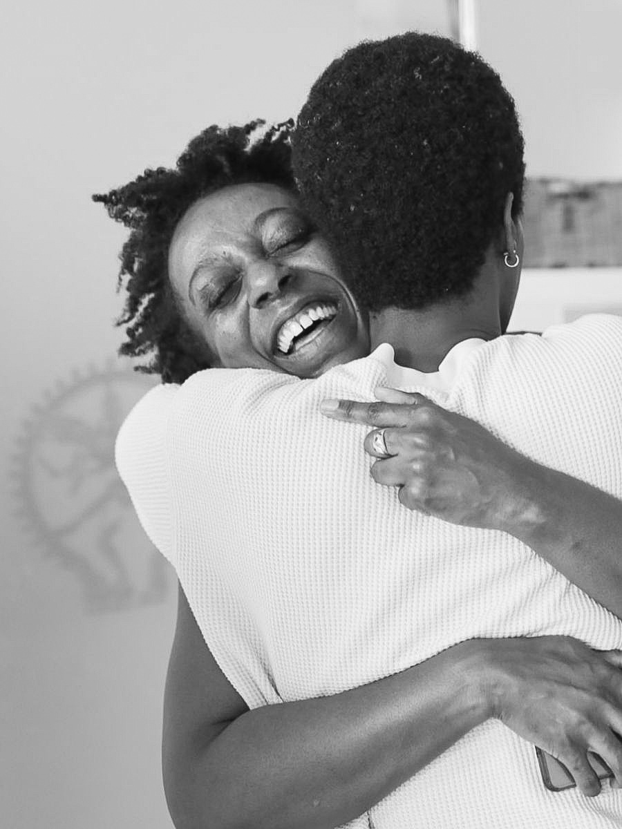 Students hugging at a Saha Gathering for yoga teachers at the Shala School of Yoga London