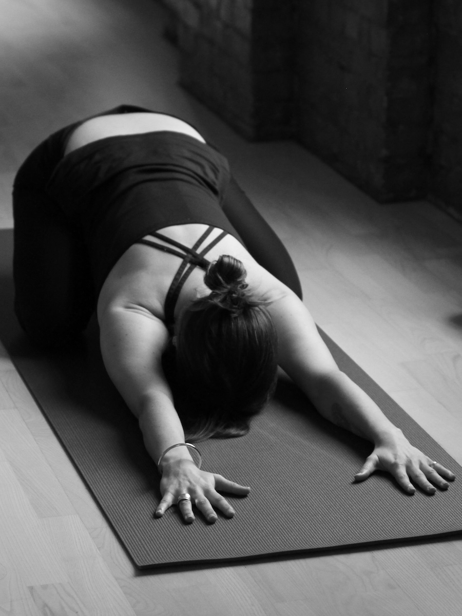 Student in a child's pose at Norman's yin yoga teacher training